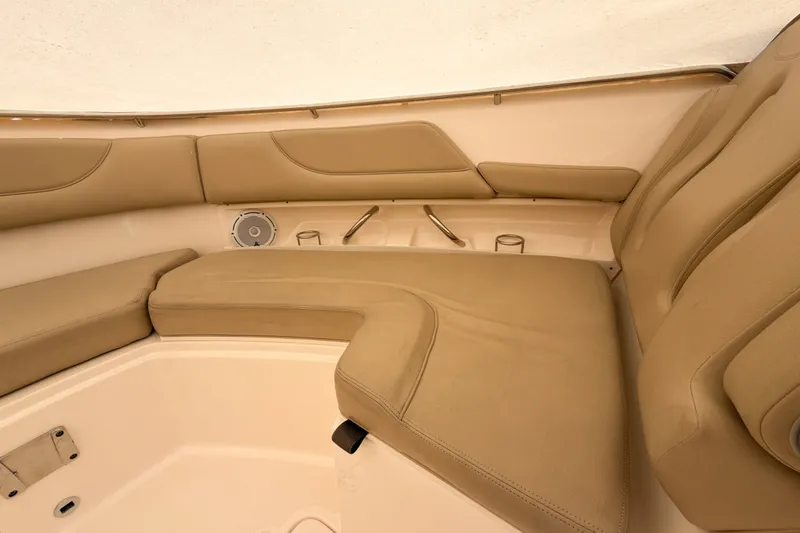 Slide: The Image of Luxurious seating area on 2015 Pursuit DC 325 Dual Console boat interior. - 12