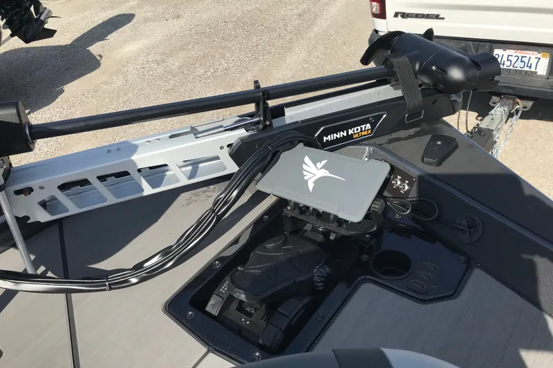 Slide: The Image of 2027 Lund 1875 Renegade boat with Minn Kota Ultrex trolling motor, parked on gravel. - 14