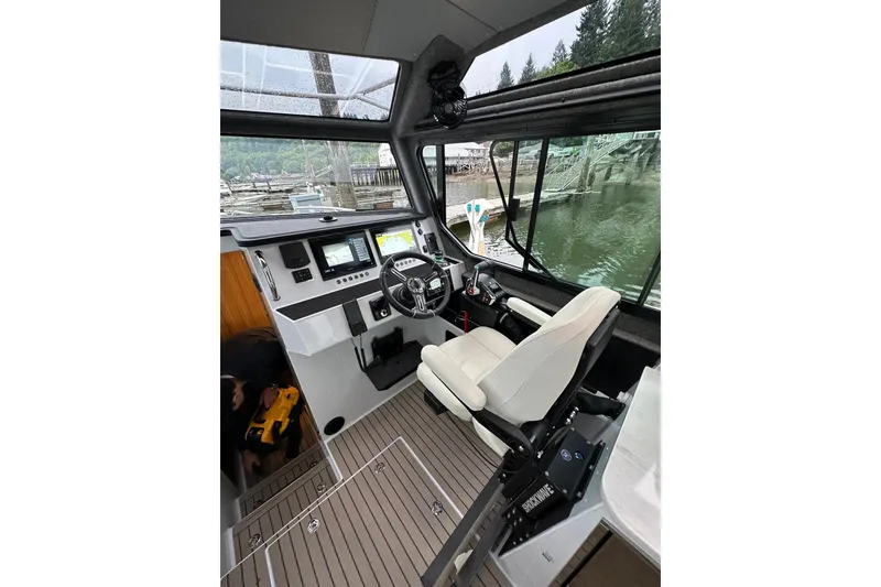 Slide: The Image of Modern 2023 Life Proof 41 full cabin boat interior with advanced navigation controls. - 45
