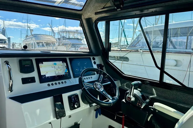 Slide: The Image of Interior of 2023 Life Proof 41 full cabin boat with modern navigation controls. - 21