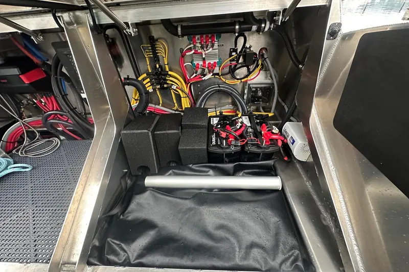 Slide: The Image of Electrical system inside 2023 Life Proof 41 full cabin boat, showcasing wiring and battery setup. - 36