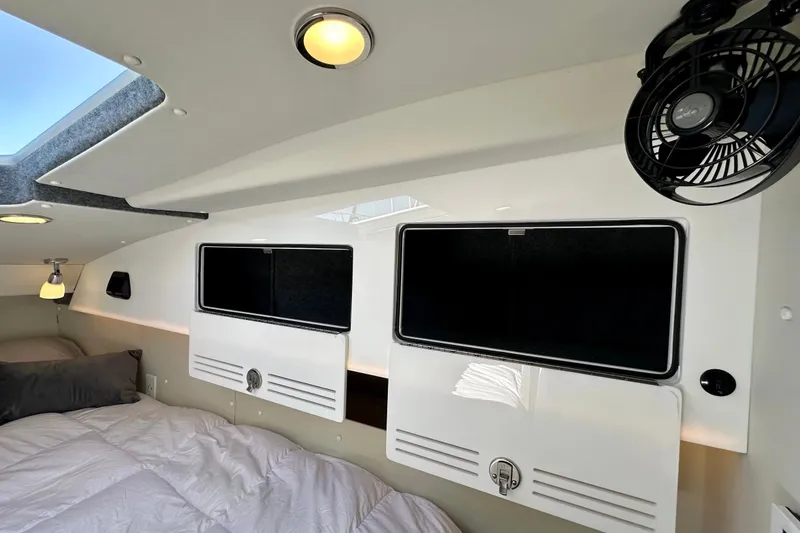 Slide: The Image of Interior of 2023 Life Proof 41 full cabin, featuring modern storage and lighting. - 26