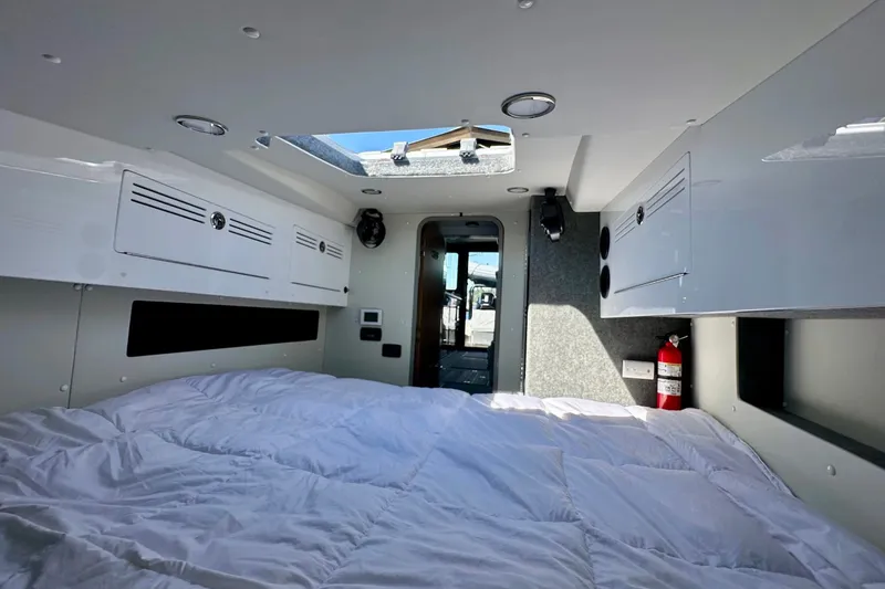 Slide: The Image of Interior of 2023 Life Proof 41 full cabin with bed, storage, and skylight. - 27