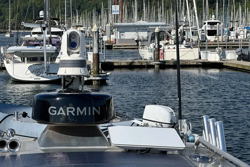Slide: The Image of 2023 Life Proof 41 full cabin boat with Garmin equipment docked at a marina. - 9