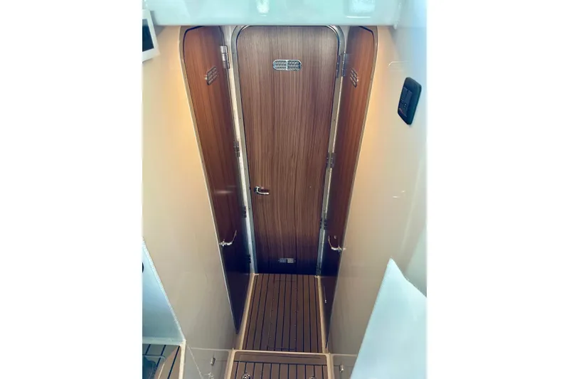 Slide: The Image of 2023 Life Proof 41 full cabin interior with wooden door and flooring. - 25