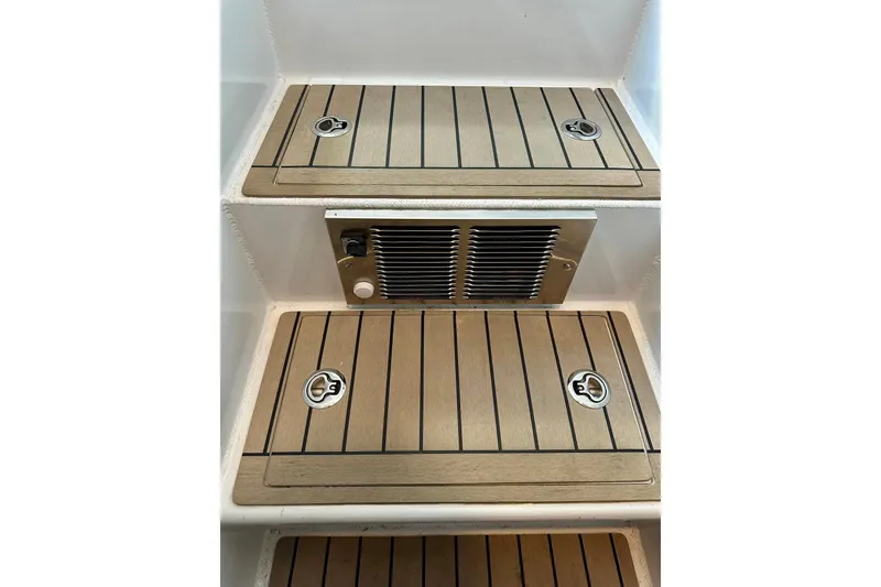 Slide: The Image of Teak steps with metal accents on 2023 Life Proof 41 full cabin boat. - 23
