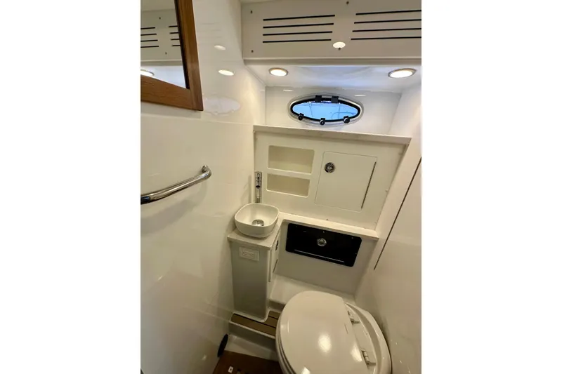 Slide: The Image of Modern bathroom in 2023 Life Proof 41 full cabin boat, featuring compact sink and toilet. - 29