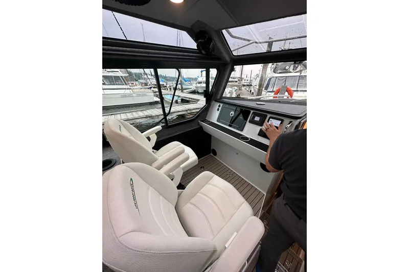 Slide: The Image of Interior of 2023 Life Proof 41 full cabin boat with modern controls and seating. - 40