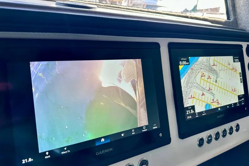 Slide: The Image of Garmin navigation screens on 2023 Life Proof 41 full cabin boat dashboard. - 7