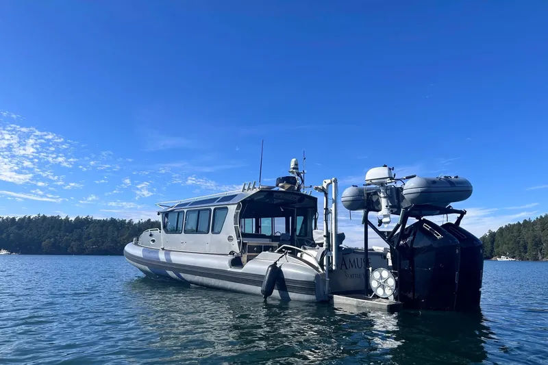 Slide: The Image of 2023 Life Proof 41 full cabin boat on calm water under clear blue sky. - 5