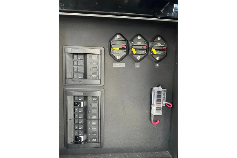 Slide: The Image of Electrical control panel on 2023 Life Proof 41 full cabin boat, featuring switches and circuit breakers. - 10