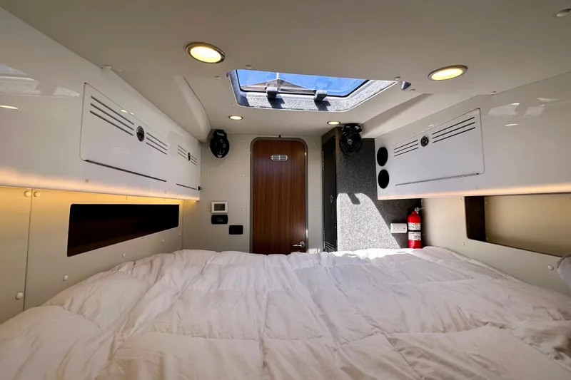 Slide: The Image of Interior of 2023 Life Proof 41 full cabin, featuring a cozy bed and skylight. - 28