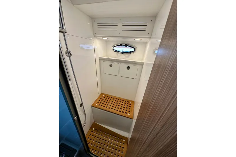 Slide: The Image of 2023 Life Proof 41 Full Cabin interior with wooden flooring and storage compartments. - 30