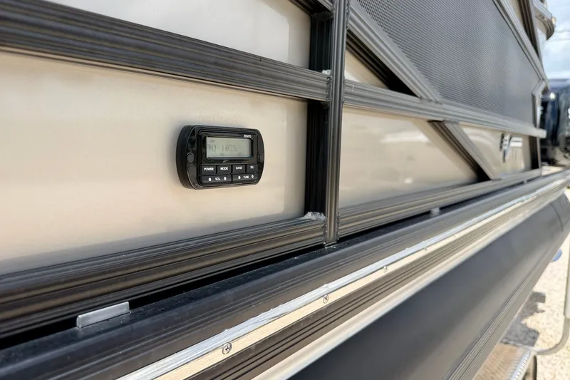 Slide: The Image of Exterior view of a 2027 Vanderbilt 700T with a mounted digital display. - 33
