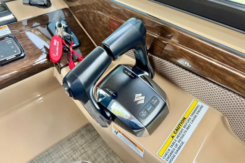 Slide: The Image of Throttle control panel in a 2027 Vanderbilt 700T boat cockpit, featuring Suzuki branding. - 24