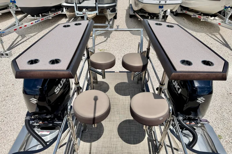 Slide: The Image of 2027 Vanderbilt 700T boat with dual Suzuki engines and seating area. - 17