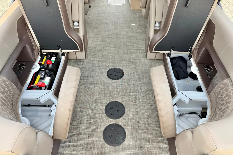 Slide: The Image of Interior of a 2027 Vanderbilt 700T with open storage compartments and visible batteries. - 31