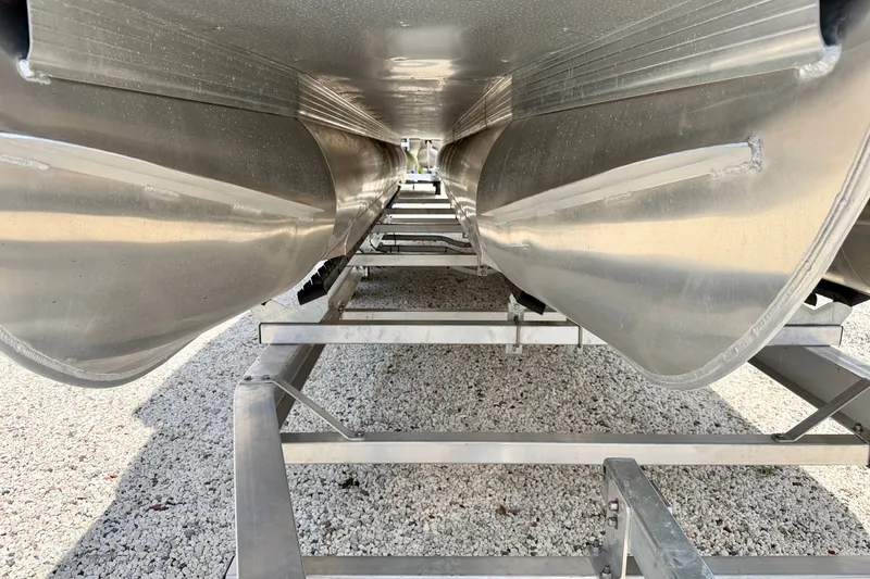 Slide: The Image of Underneath view of a 2027 Vanderbilt 700T pontoon boat on a trailer. - 35