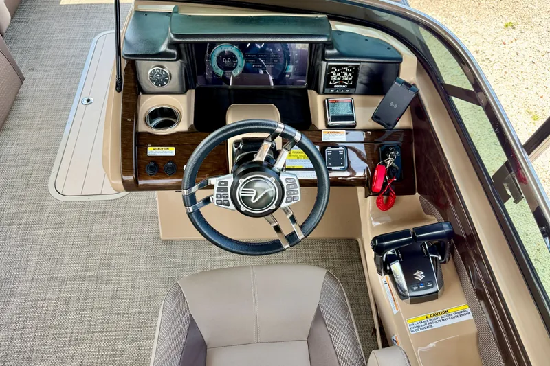 Slide: The Image of Cockpit of 2027 Vanderbilt 700T boat with modern steering and control panel. - 21