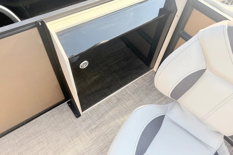Slide: The Image of 2026 Bentley Pontoons Fish 220 Fish-N-Cruise interior with seating and storage compartment. - 19