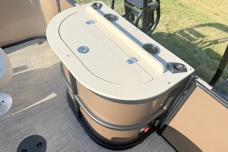 Slide: The Image of 2026 Bentley Pontoons Fish 220 Fish-N-Cruise interior with storage compartment and cup holders. - 21