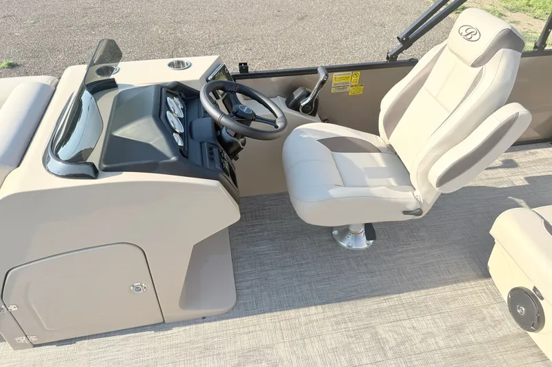 Slide: The Image of 2026 Bentley Pontoons Fish 220 Fish-N-Cruise helm with steering wheel and captain's chair. - 17