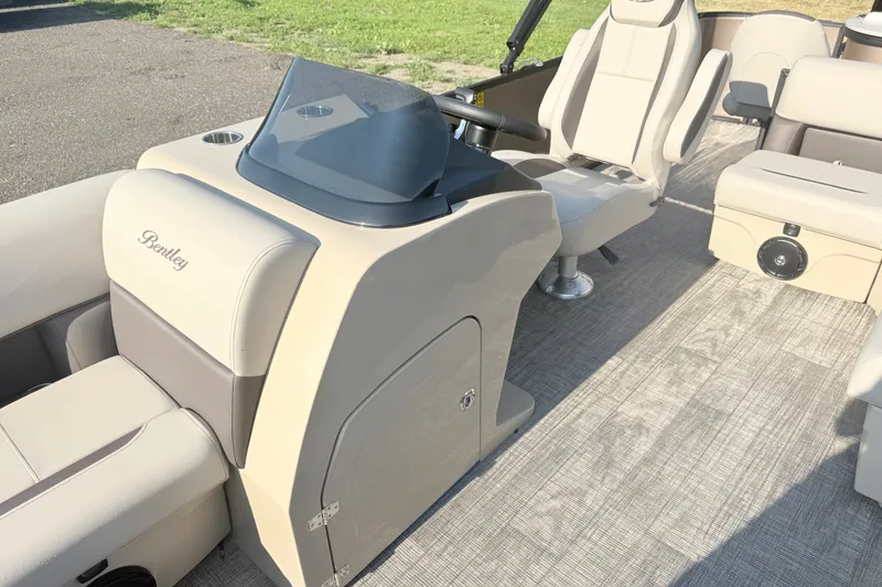 Slide: The Image of 2026 Bentley Pontoons Fish 220 Fish-N-Cruise interior with beige seating and helm. - 15