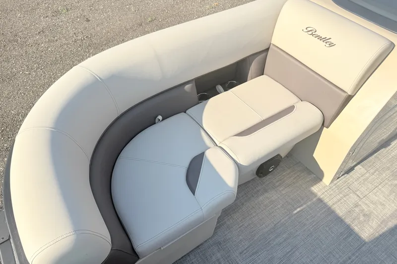 Slide: The Image of 2026 Bentley Pontoons Fish 220 Fish-N-Cruise, luxurious seating detail, beige upholstery. - 13