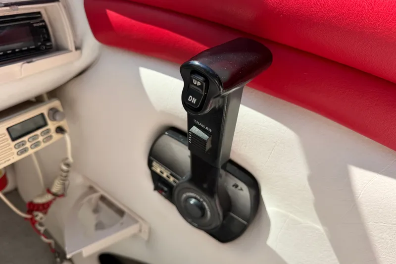 Slide: The Image of Throttle control lever in a 2006 Crownline 266 BR boat cockpit. - 17