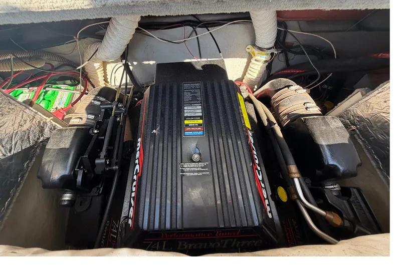 Slide: The Image of Engine compartment of a 2006 Crownline 266 BR boat with MerCruiser components. - 20