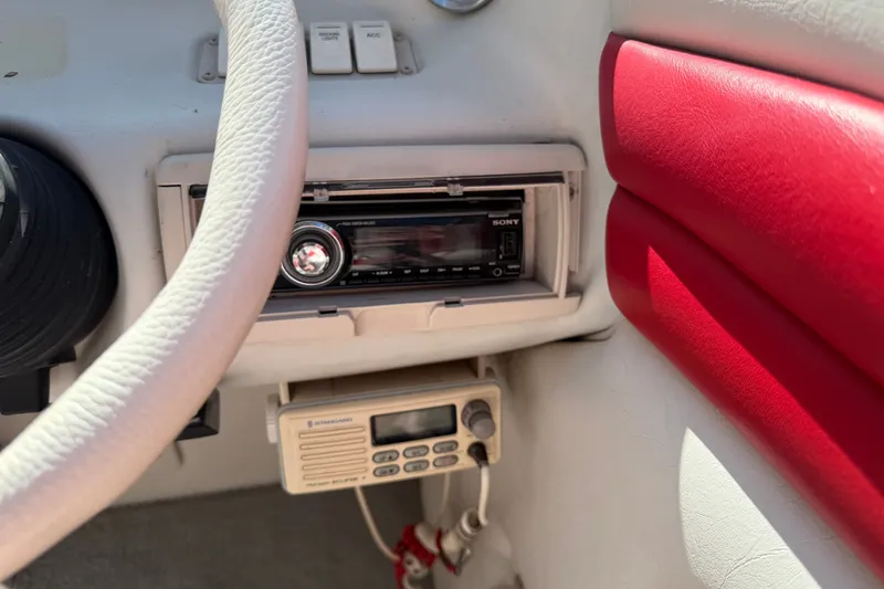 Slide: The Image of 2006 Crownline 266 BR boat dashboard with Sony stereo and communication device. - 16
