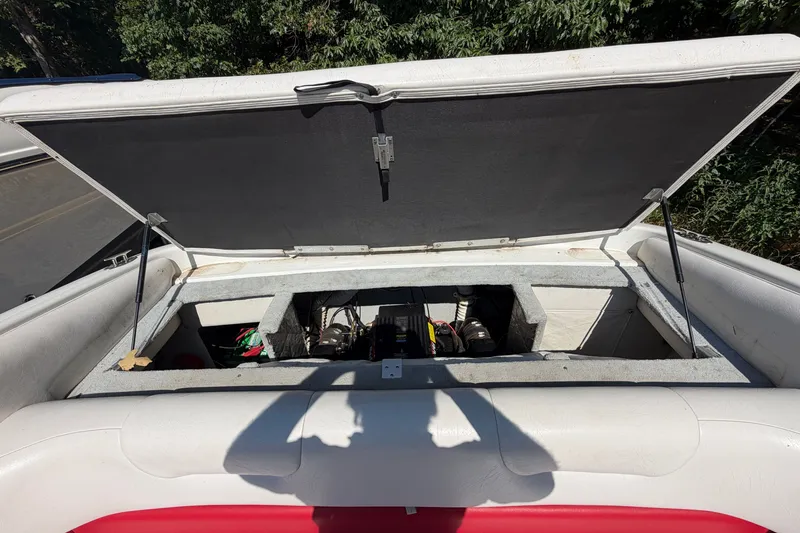 Slide: The Image of Open engine compartment of a 2006 Crownline 266 BR boat, showing interior components. - 18