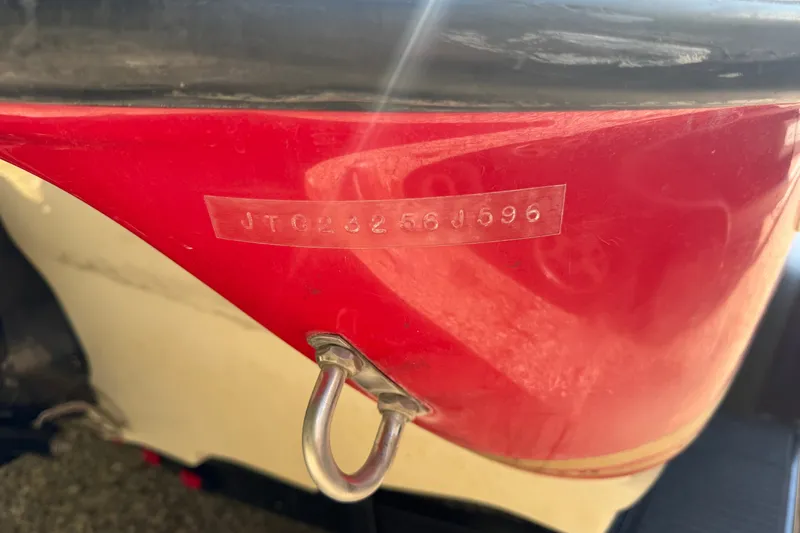 Slide: The Image of Close-up of a 2006 Crownline 266 BR boat hull with visible serial number. - 22
