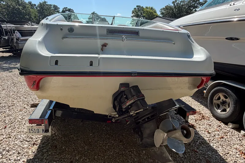 Slide: The Image of 2006 Crownline 266 BR boat on trailer, rear view with outboard motor. - 4