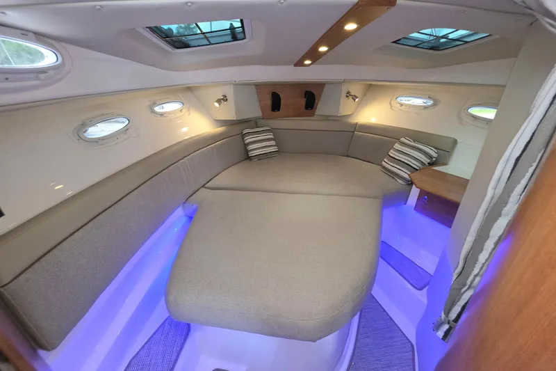 Slide: The Image of 2027 Cutwater C-32 Coupe interior cabin with cozy seating and ambient lighting. - 28