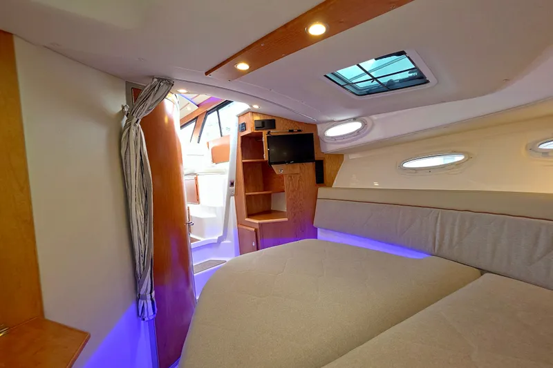 Slide: The Image of Luxurious interior of 2027 Cutwater C-32 Coupe boat with modern amenities and cozy seating. - 27