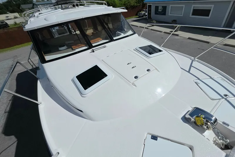 Slide: The Image of 2027 Cutwater C-32 Coupe boat deck with sleek design and modern features. - 33