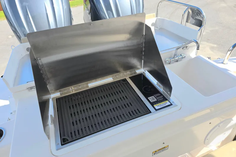 Slide: The Image of Outdoor grill and sink on 2027 Cutwater C-32 Coupe boat deck. - 35