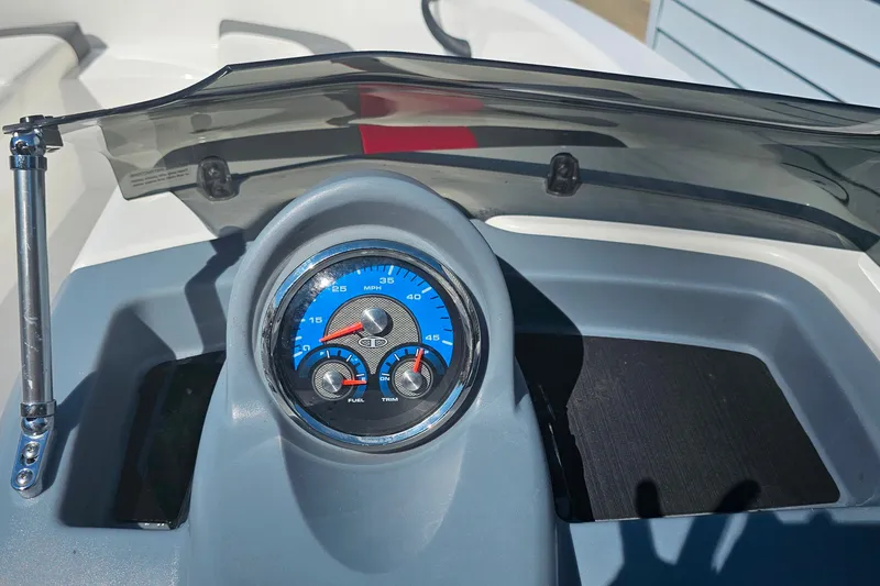 Slide: The Image of Dashboard of a 2022 Tahoe T16 boat with speedometer and gauges. - 11