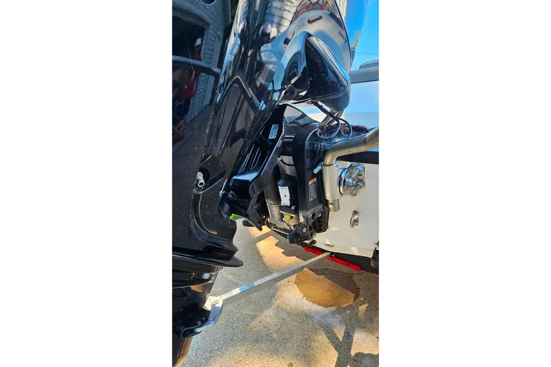 Slide: The Image of Close-up of a 2022 Tahoe T16 boat engine, showcasing its sleek design and components. - 25