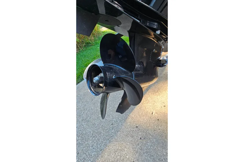 Slide: The Image of 2022 Tahoe T16 boat propeller on concrete surface, showcasing sleek design. - 26