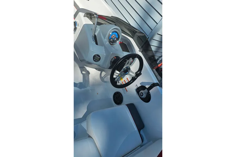 Slide: The Image of 2022 Tahoe T16 boat cockpit with steering wheel and control panel. - 22