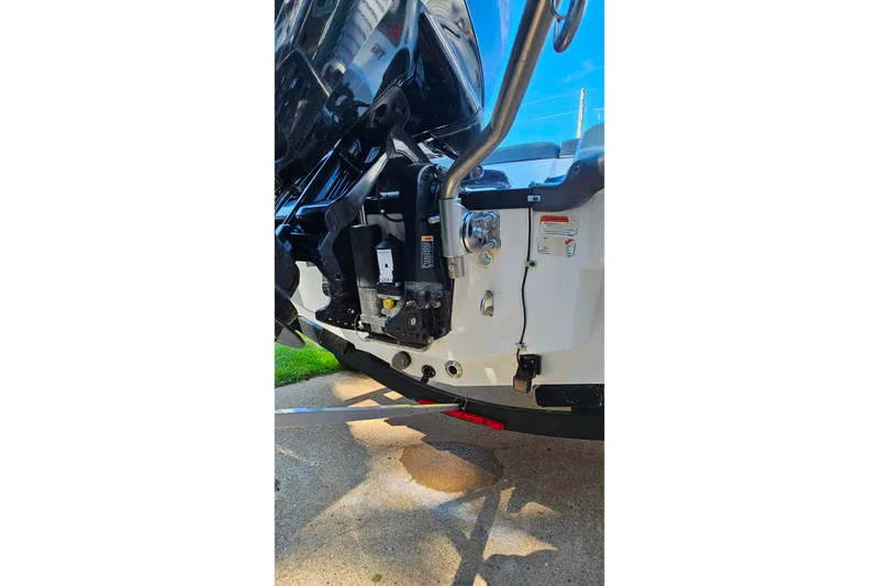 Slide: The Image of 2022 Tahoe T16 boat engine and transom detail in bright sunlight. - 23