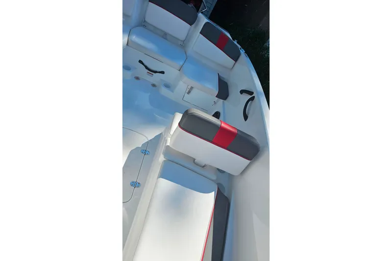 Slide: The Image of 2022 Tahoe T16 boat interior with white and red seating, showcasing modern design. - 17