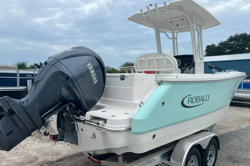 Slide: The Image of 2025 Robalo R230 Center Console boat with Yamaha engine on trailer. - 6
