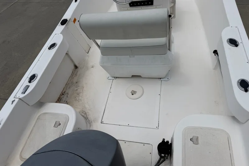 Slide: The Image of 2005 McKee Craft Marathon 172 CC boat interior with seating and storage compartments. - 6