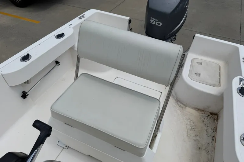 Slide: The Image of 2005 McKee Craft Marathon 172 CC boat interior with seating and Yamaha 90 engine. - 8