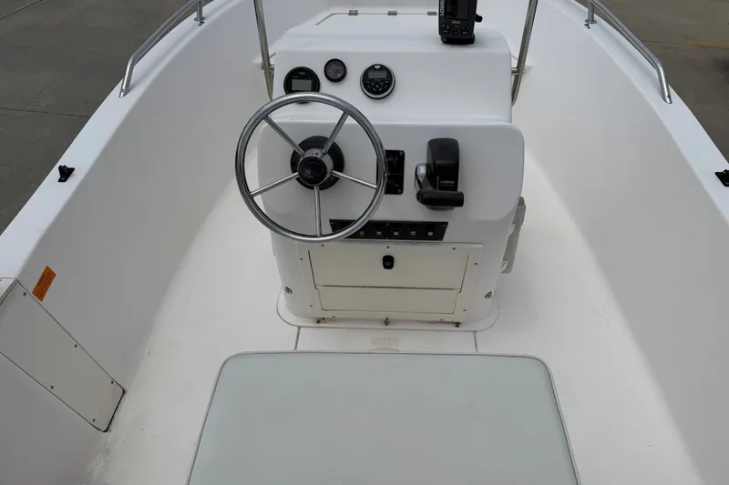 Slide: The Image of 2005 McKee Craft Marathon 172 CC boat console with steering wheel and controls. - 7