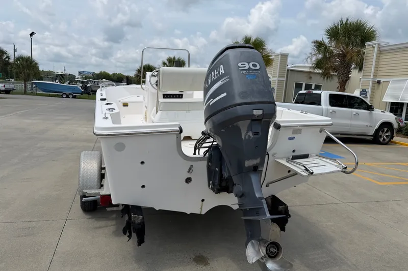 Slide: The Image of 2005 McKee Craft Marathon 172 CC boat with Yamaha 90 engine, parked outdoors. - 2