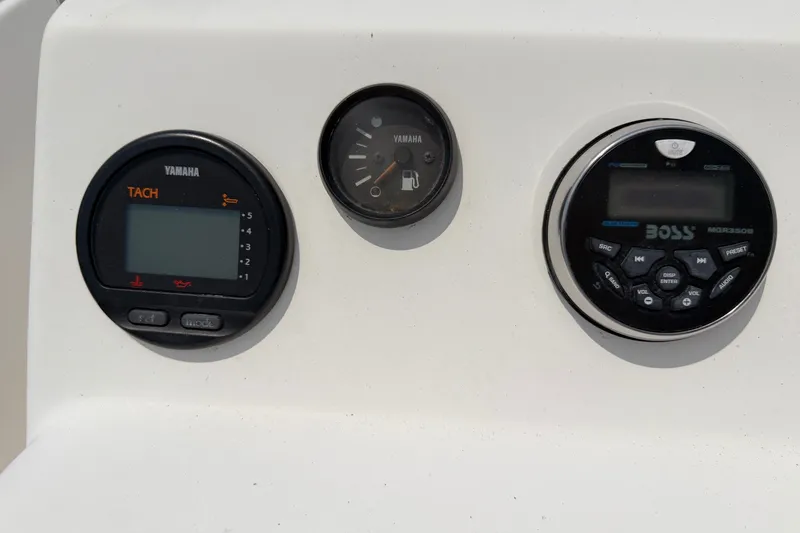 Slide: The Image of Dashboard of a 2005 McKee Craft Marathon 172 CC with Yamaha gauges and Boss audio system. - 10